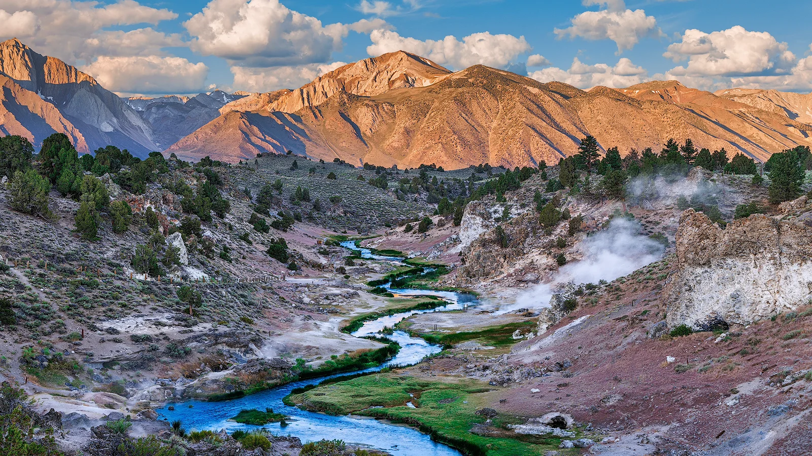 Timelapse at Hot Creek, California, with mountain range in the background